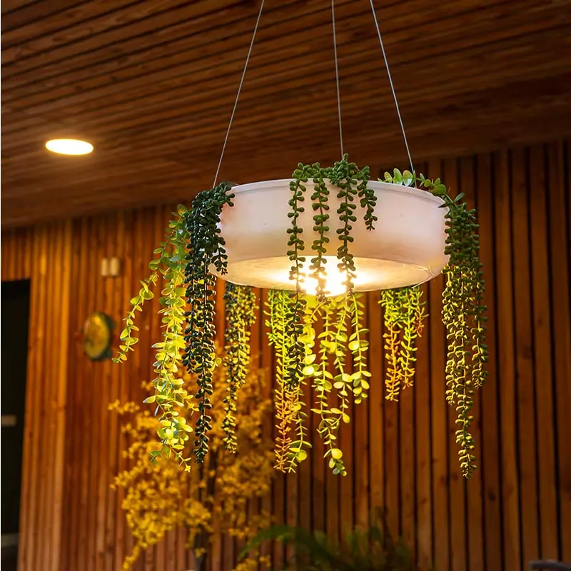 beleuchtet Blumentoepfe